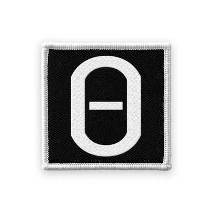 Embroidered black patch with white Theta symbol from Val Halvorson Nowhere Generation Bundle