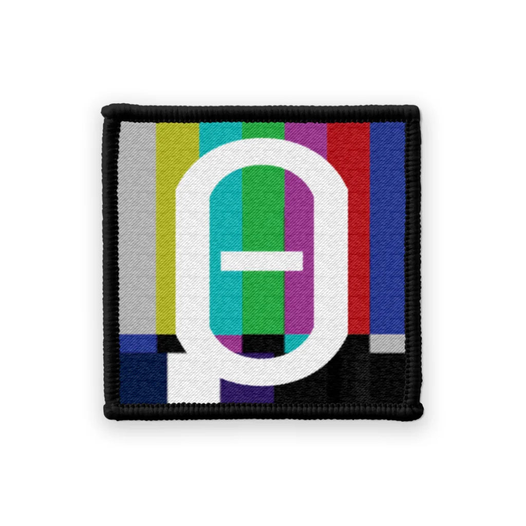 Embroidered patch with colorful TV test pattern and white Theta symbol for Val Halvorson