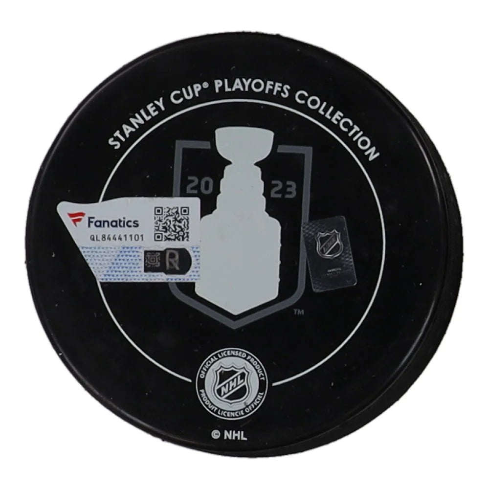 Black NHL Stanley Cup Champions hockey puck with champions logo and authentication stickers