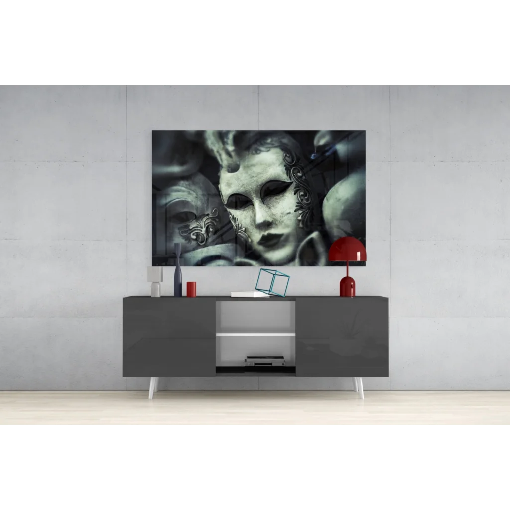 Black and white ornate Venetian mask wall art above gray console
