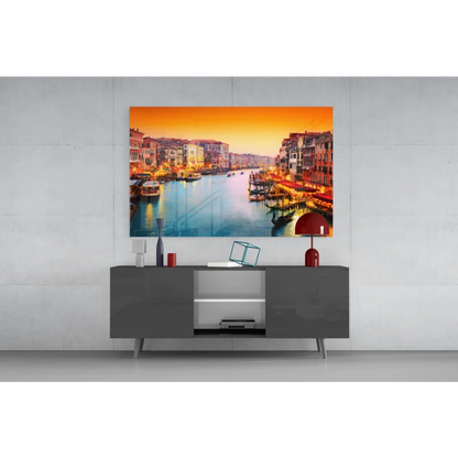Vibrant orange and blue canal glass wall art canvas print on gray console