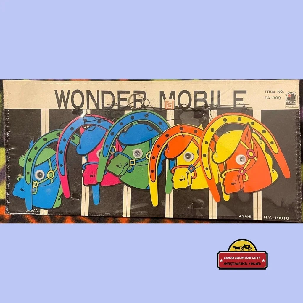 Colorful vintage toy mobile with animal shapes, perfect for rare 1950s blacklight lovers