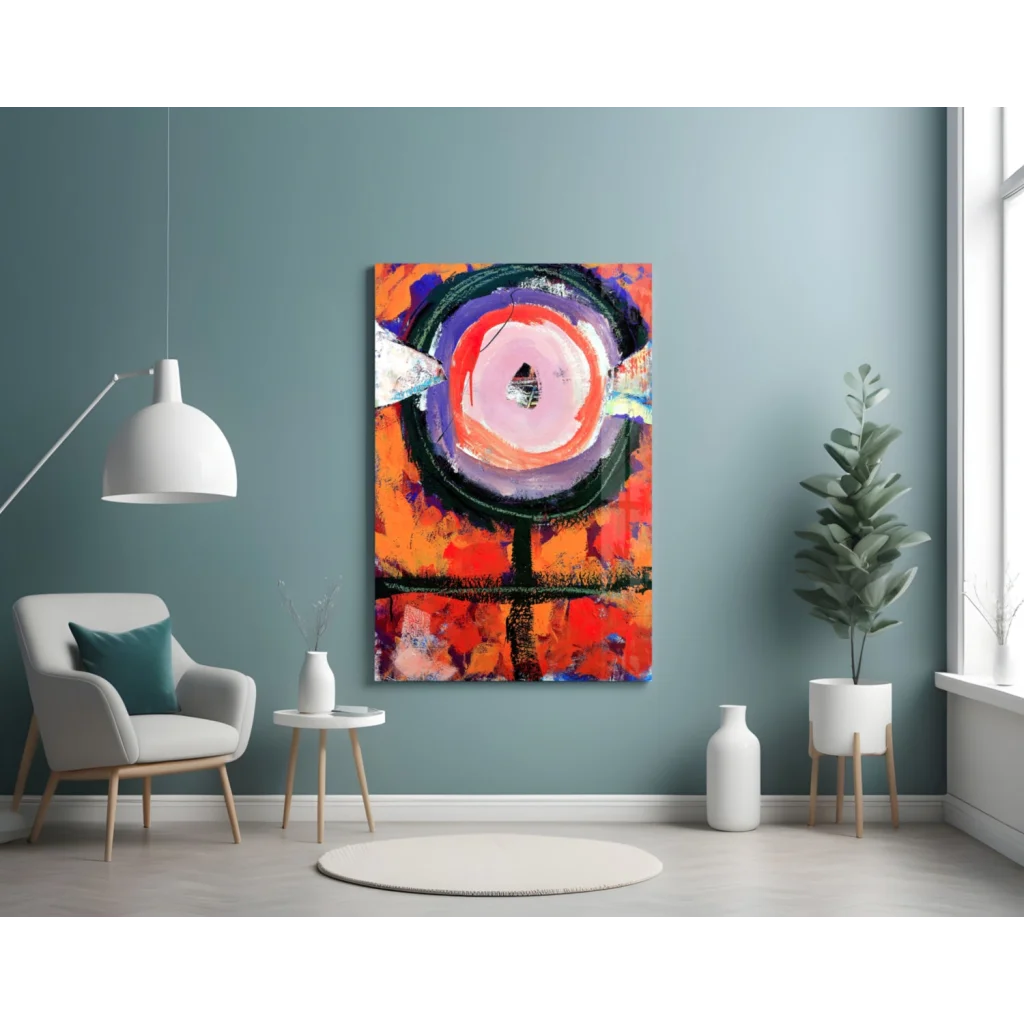 Vibrant orange and black abstract wall art with white triangle on teal wall