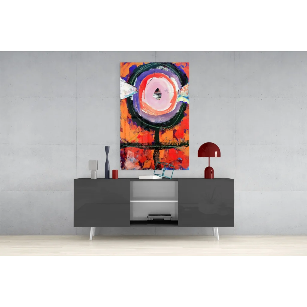 Modern gray sideboard with sleek white legs under vibrant orange pink wall art