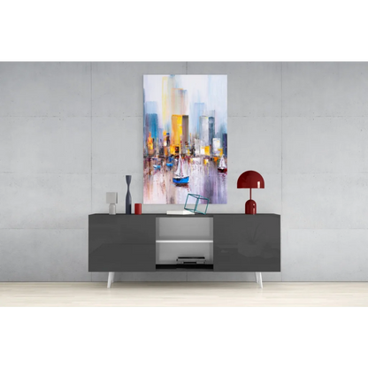 Vibrant abstract cityscape glass wall art with sailboats on modern gray sideboard