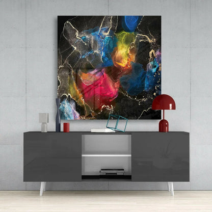 Modern black and white sideboard with sleek legs and vibrant glass wall art