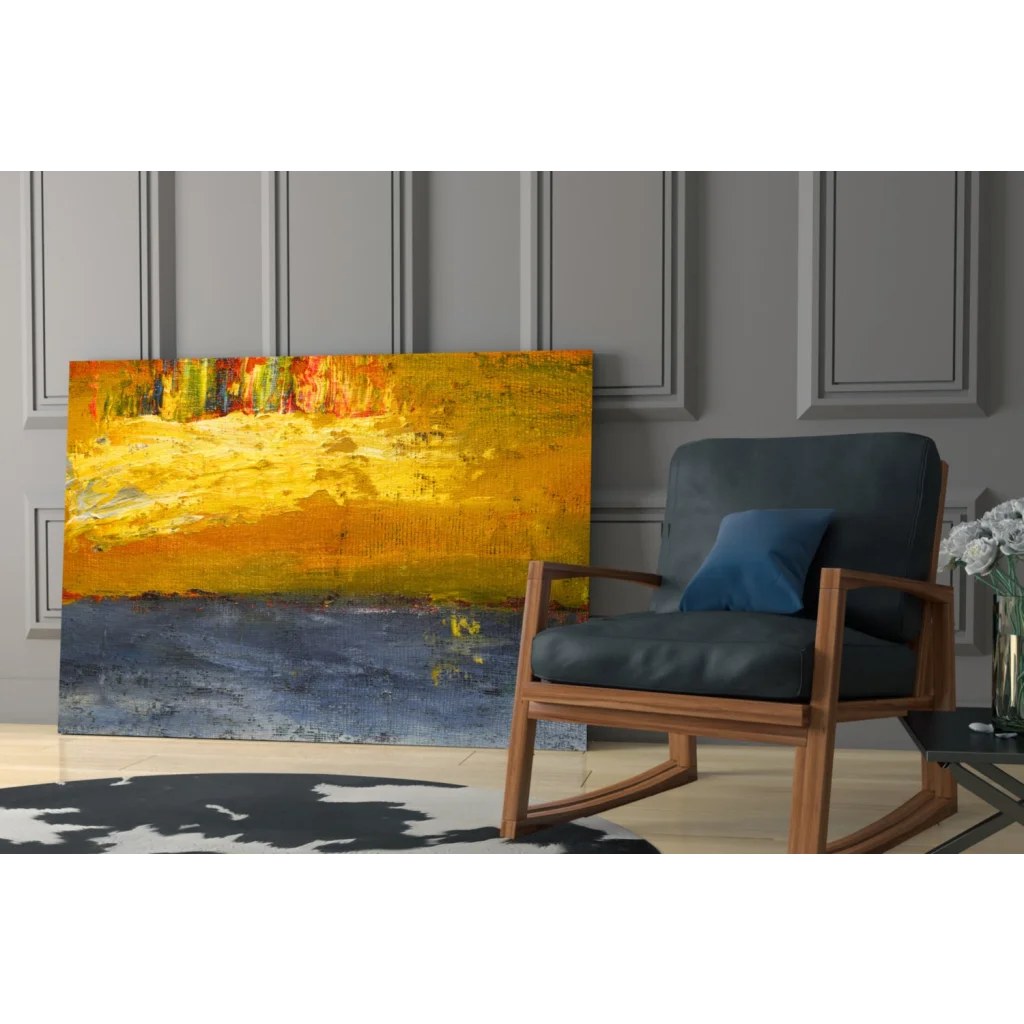 Modern rocking chair with blue cushions near vibrant blue wall art