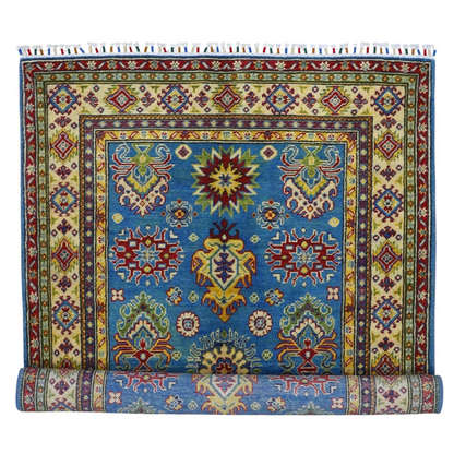 Vibrant blue Afghan Kazak rug with cotton foundation and colorful patterns