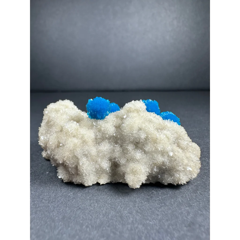Vibrant blue Cavansite balls on white Stilbite matrix from India