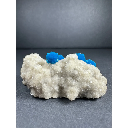 Vibrant blue Cavansite balls on white Stilbite matrix from India