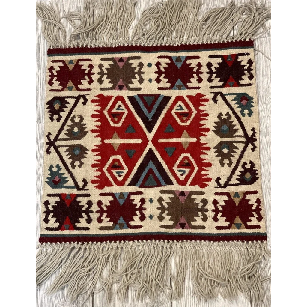 Bulgarian Kilim rug, full view, bold red geometric patterns and fringe edge, hand-made natural wool