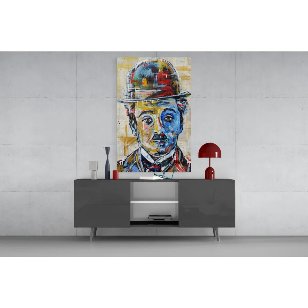 Modern gray sideboard with silver accents and vibrant Charlie Chaplin glass wall art