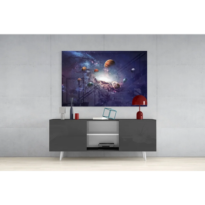 Modern gray TV stand with white legs and open storage under vibrant cosmic planets wall art