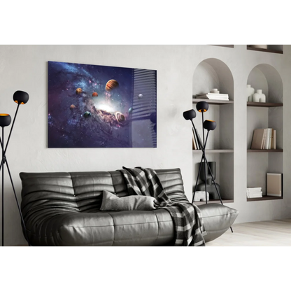 Black leather couch with plaid blanket and cosmic planets wall art
