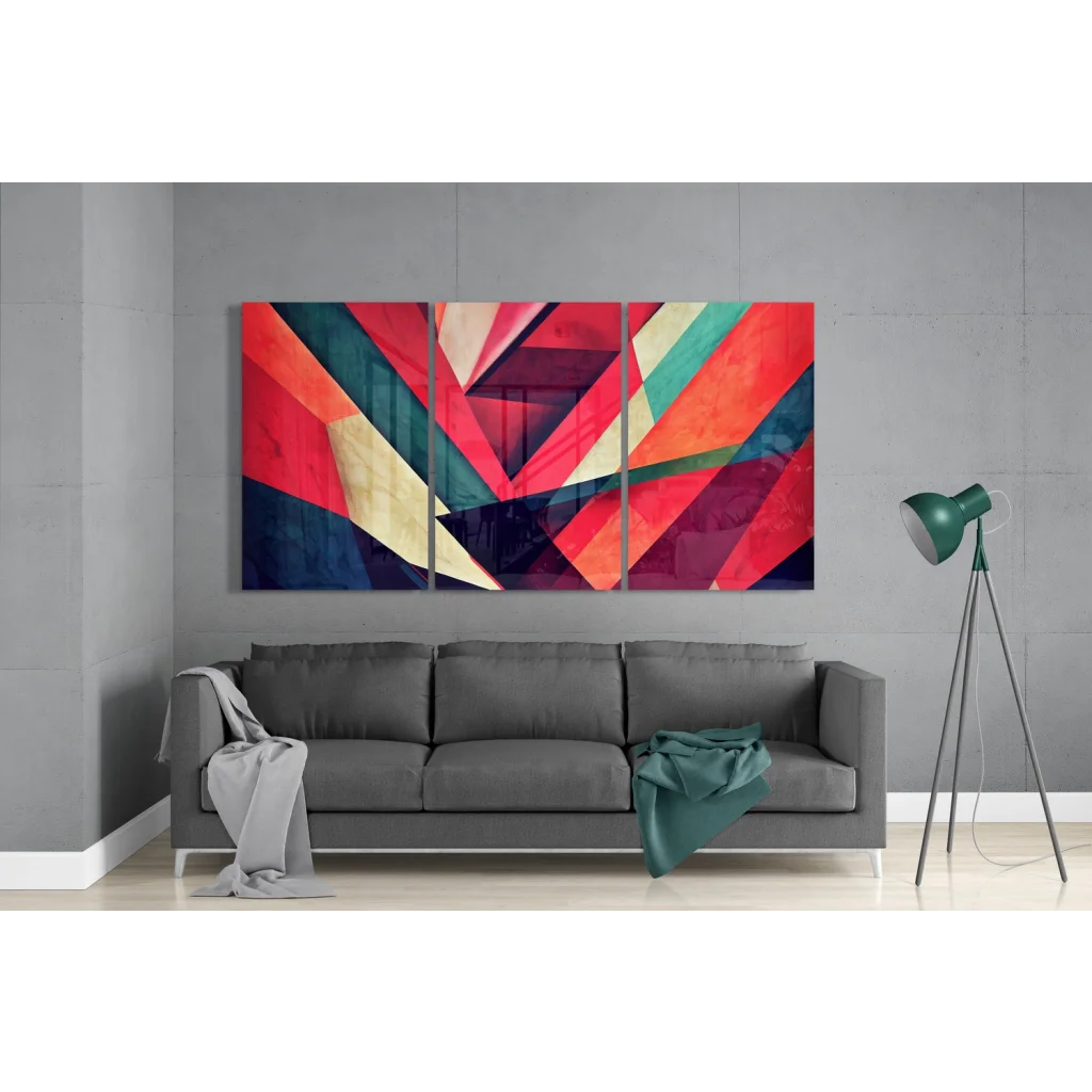 Vibrant glass wall art with bold geometric designs in reds and blues