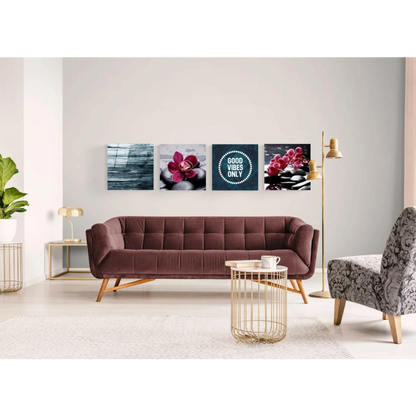 Plush burgundy velvet sofa with tufted upholstery and light wood legs, paired with vibrant glass wall art