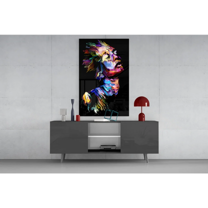 Vibrant lion glass wall art with bold abstract colors on gray sideboard