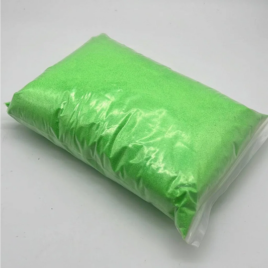 Bright green craft sand in a bag from the Vibrant Neon Craft Sand Collection in Electric Colors