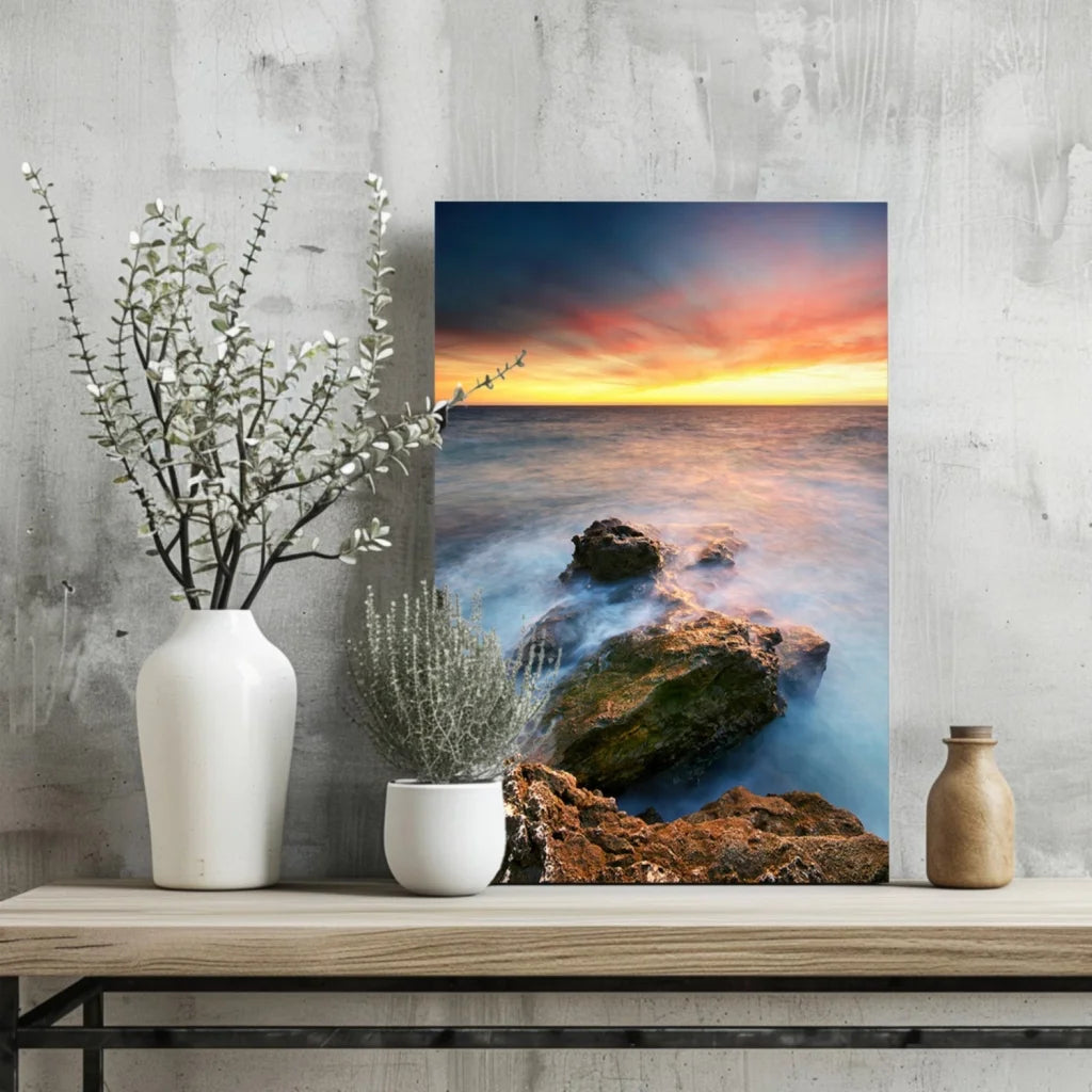 Vibrant ocean sunset canvas print with flowing waves and rugged rocks