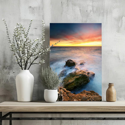 Vibrant ocean sunset canvas print with flowing waves and rugged rocks