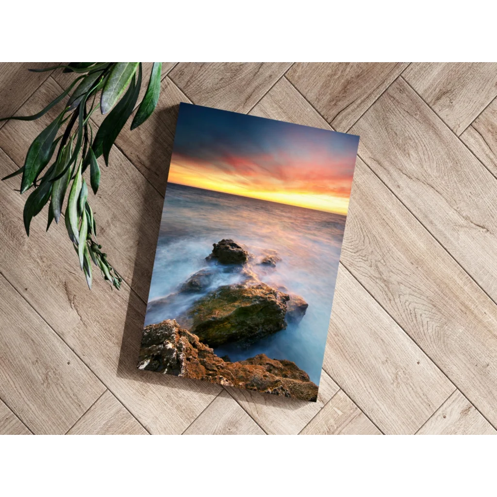 Vibrant ocean sunset canvas print with flowing waves and mossy rocks