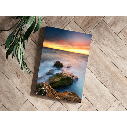 Vibrant ocean sunset canvas print with flowing waves and mossy rocks