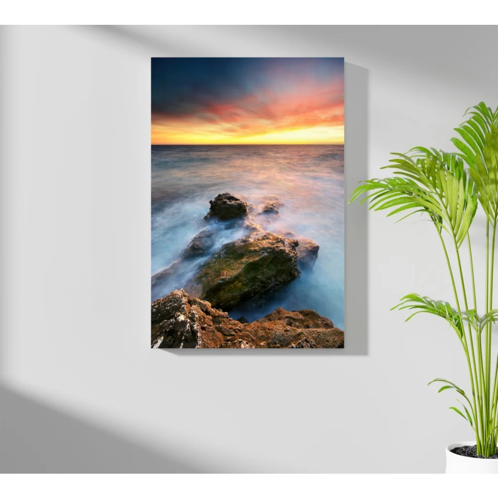 Vibrant ocean sunset canvas print with flowing waves and rugged rocks