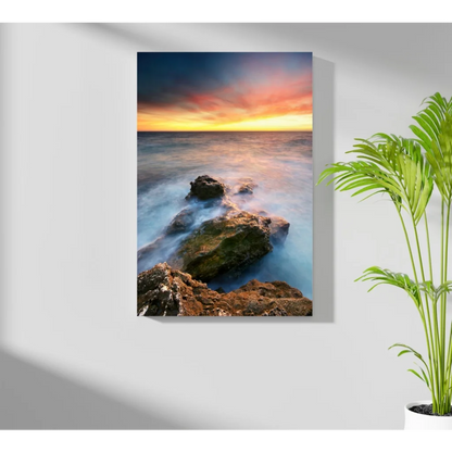 Vibrant ocean sunset canvas print with flowing waves and rugged rocks