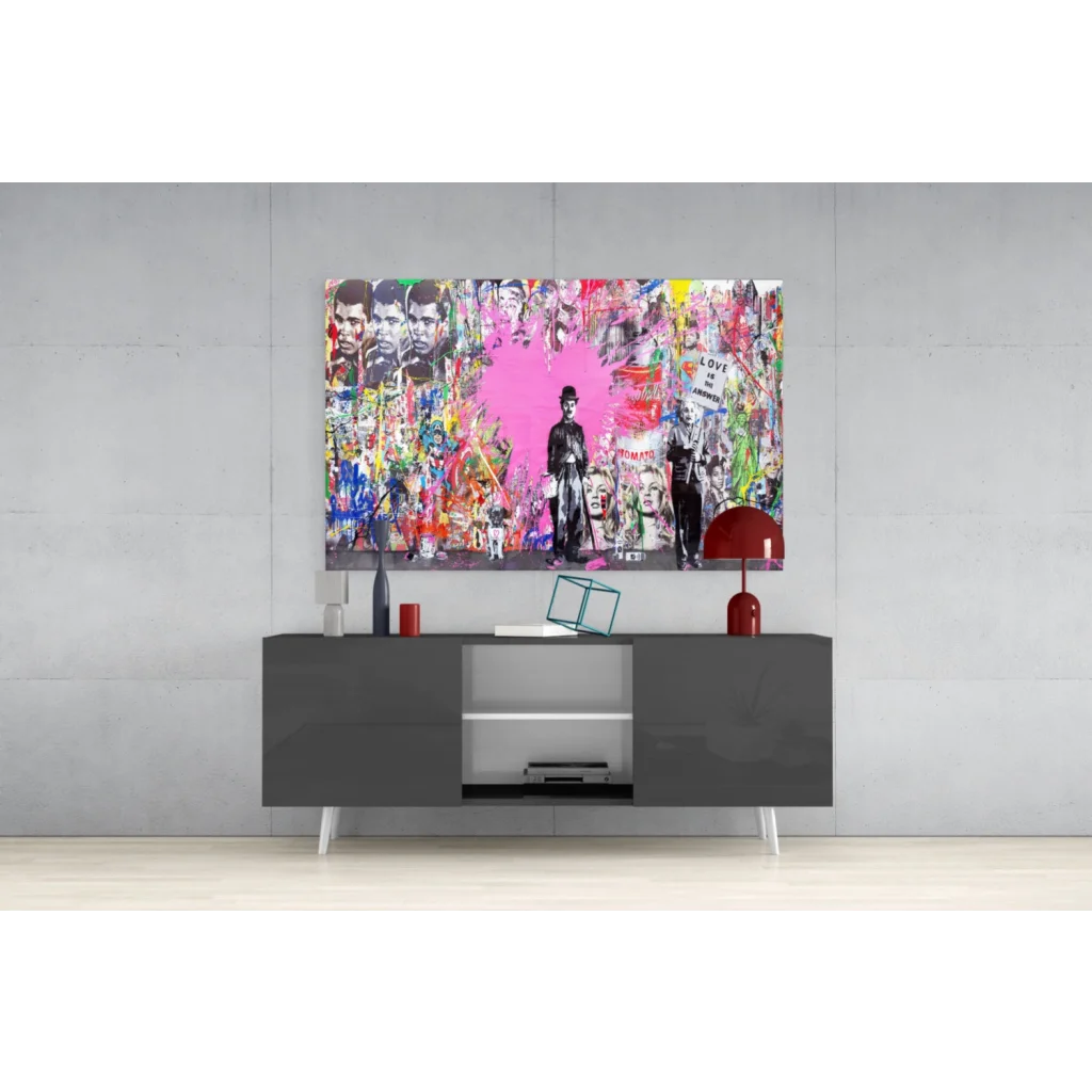 Modern gray TV stand with white legs and silver accents under Vibrant Pink Heart Urban wall art