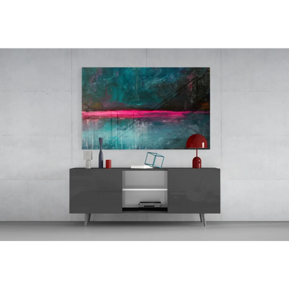 Modern black lacquered sideboard with sleek silver legs under vibrant pink teal abstract wall art