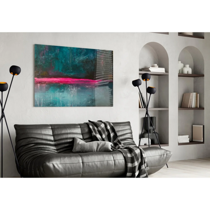 Modern leather sofa with black gray throw under vibrant pink teal wall art