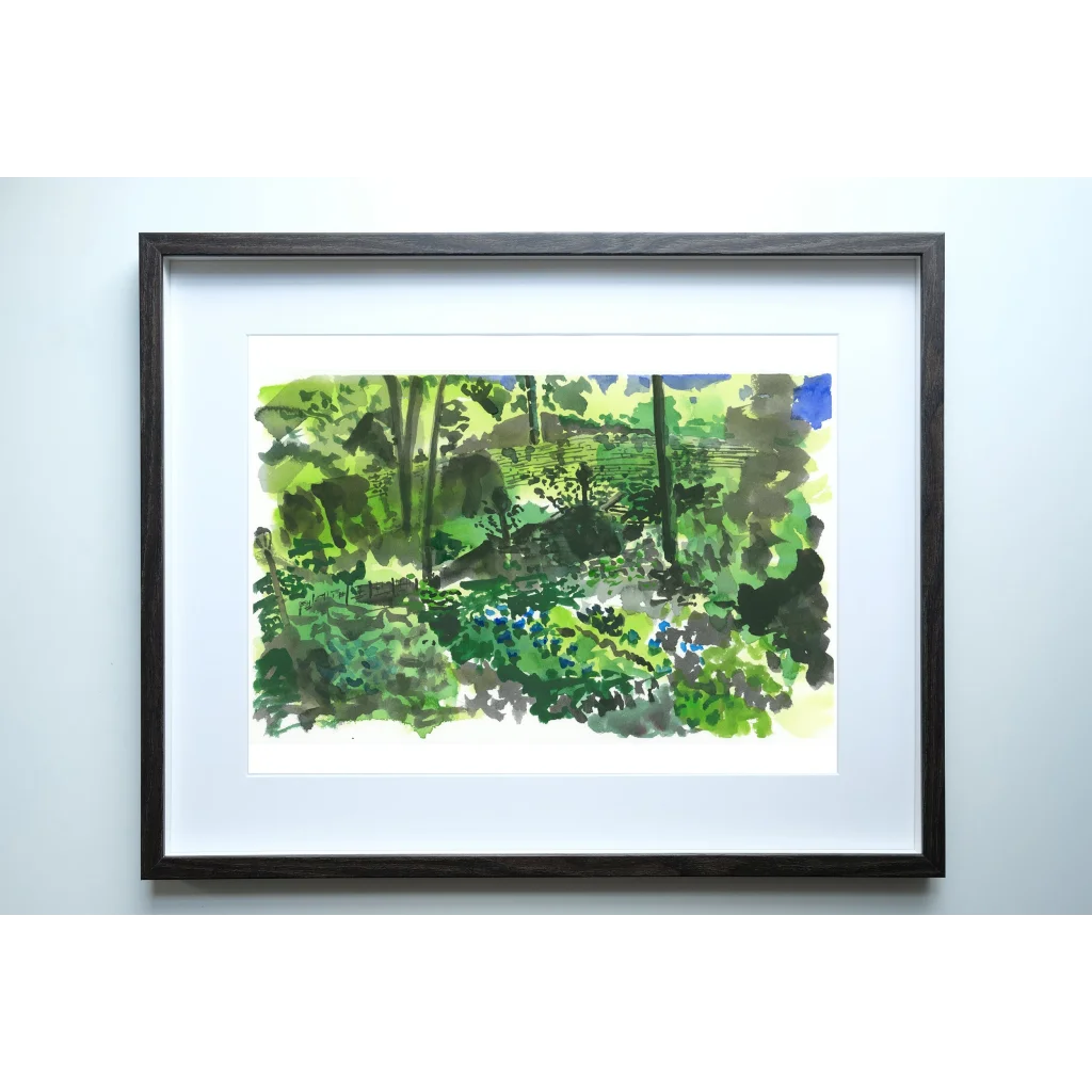 Black framed plein air painting of lush green Fort Tryon Park forest
