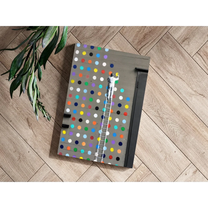 Vibrant multi-colored polka dot notebook with metallic edge art print