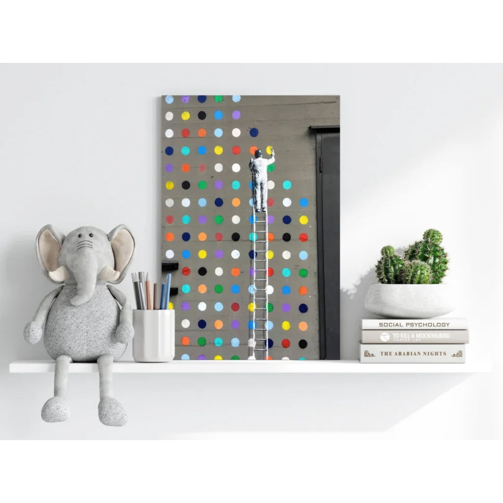 Gray plush elephant toy with floppy ears on vibrant polka dot shelf