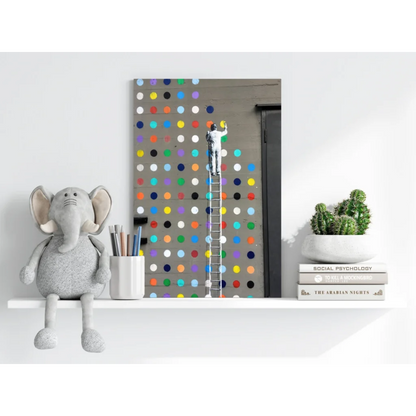 Gray plush elephant toy with floppy ears on vibrant polka dot shelf