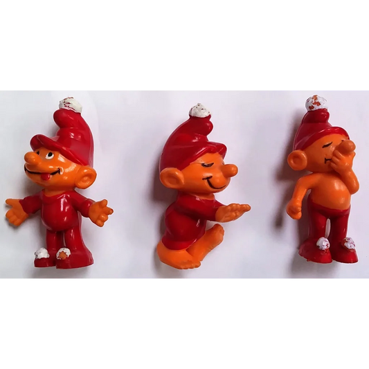 Vibrant red orange troll figurines with white details