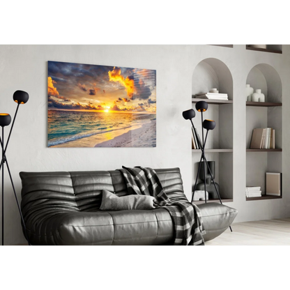 Leather sofa with checkered throw and vibrant sunset beach wall art