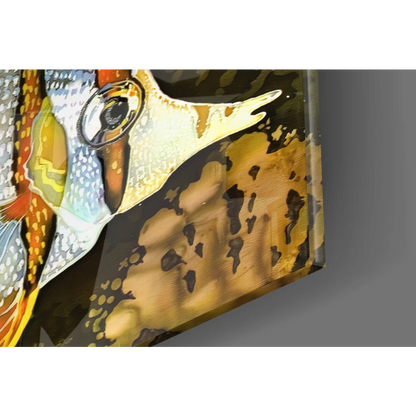 Vibrant gold fish keychain with black orange accents on glass wall art