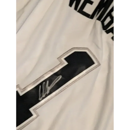 White Victor Wembanyama autographed jersey with black and silver number 1 and signature