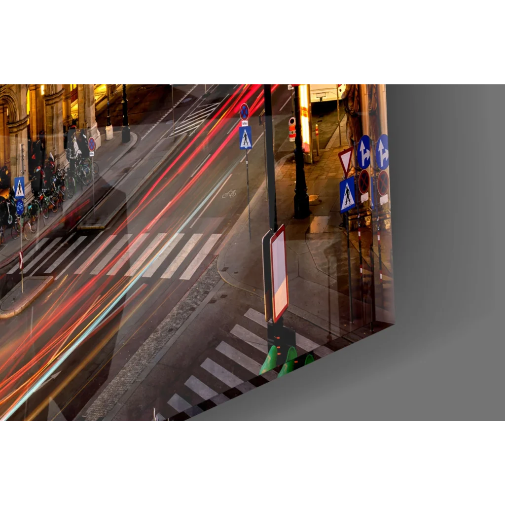 Vibrant glass wall art of nighttime city street with light trails