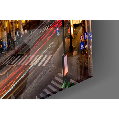 Vibrant glass wall art of nighttime city street with light trails