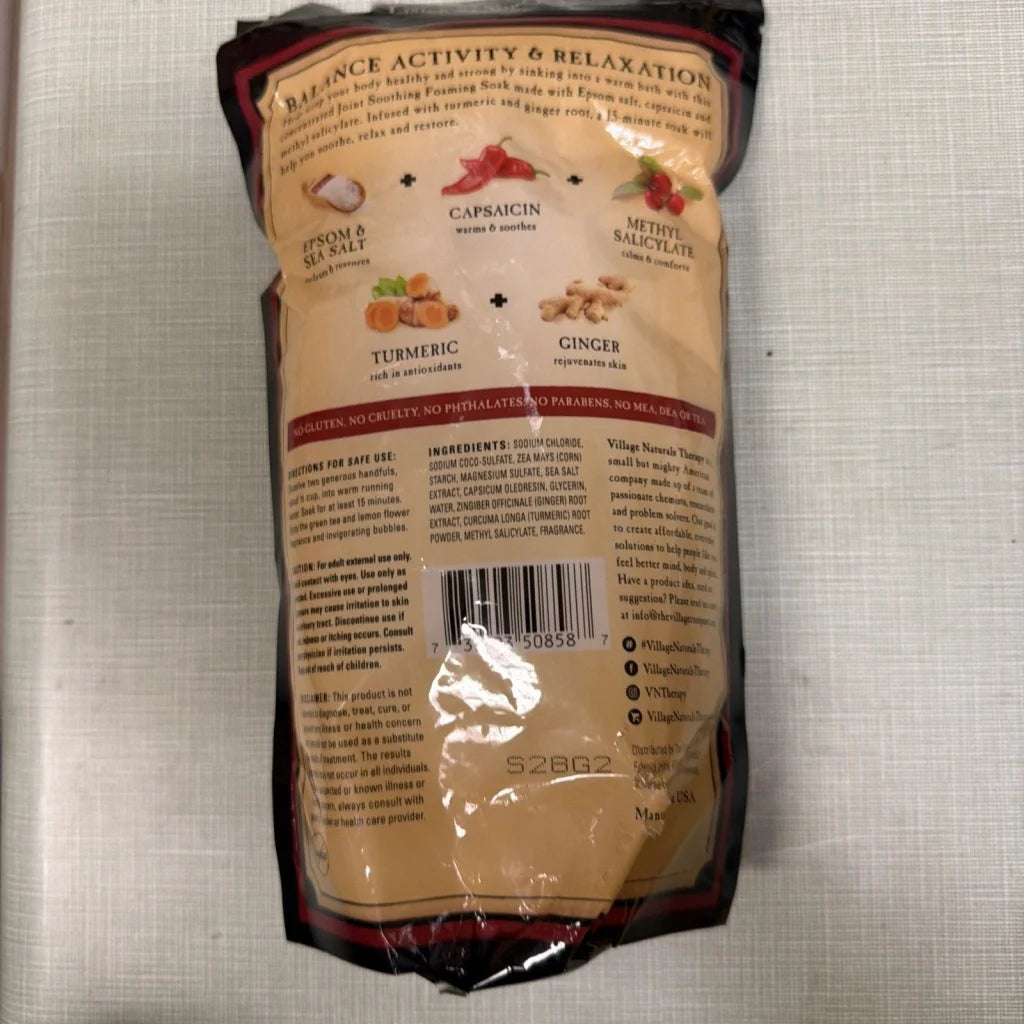 Village Naturals Therapy foaming concentrated mineral bath soak, 36 oz, beige red package with turmeric ginger capsaicin labels