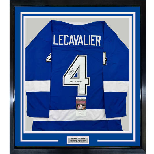 Front view of a framed blue and white striped Tampa Bay Lightning hockey jersey with "LECAVALIER" and number 4, signed and authenticated with JSA certification sticker.
