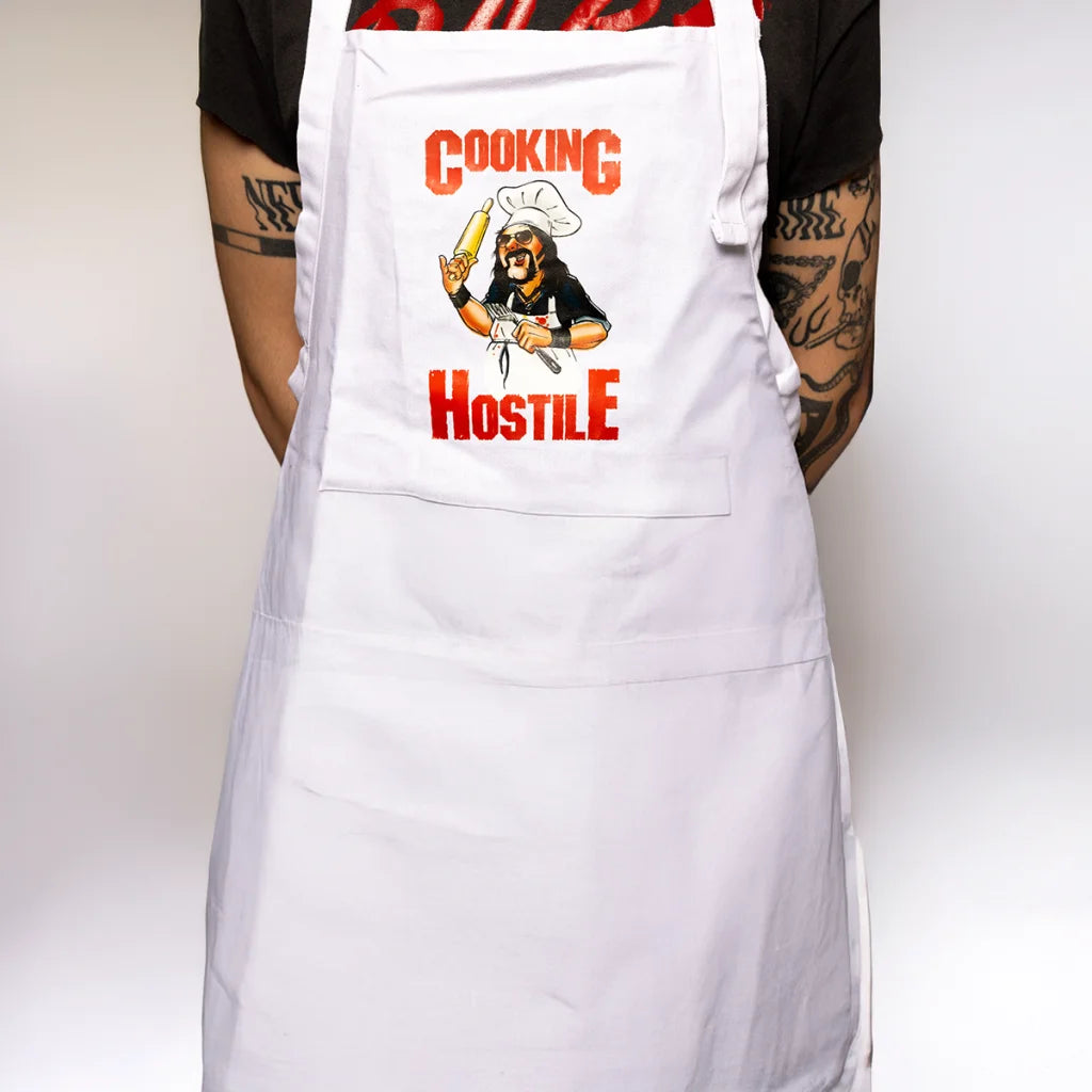 White chef apron with heavy metal chef graphic from Vinnie Paul Texas Beef Grilling Cookbook
