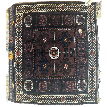 Vintage 1930s Afghan Baluch bag face, full view, dark brown ground with bold geometric tribal patterns