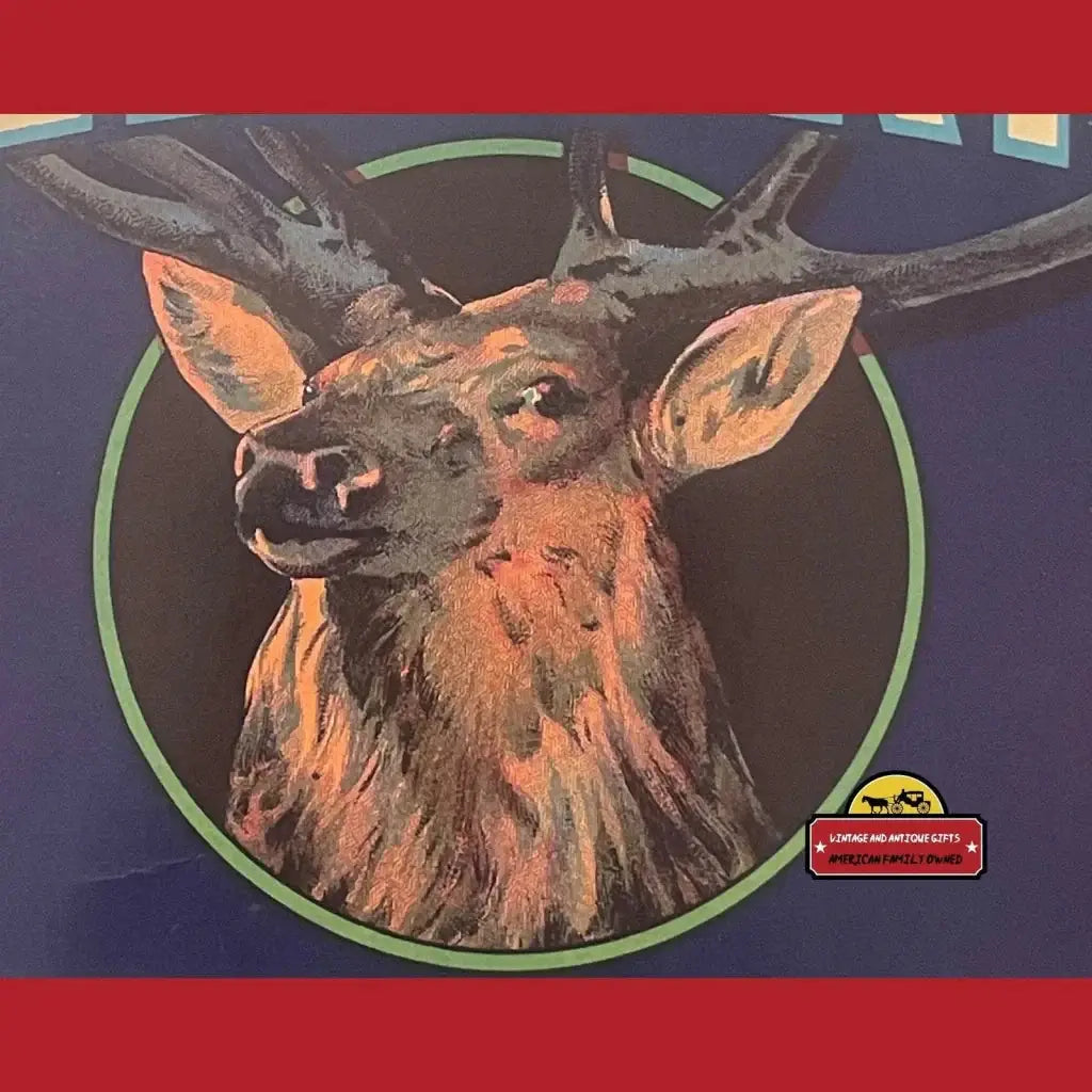 Vintage elk head crate label sticker with antlers in orange, brown, black