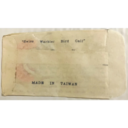 Label with text about Swiss Warbler Bird Call made in Taiwan for vintage product