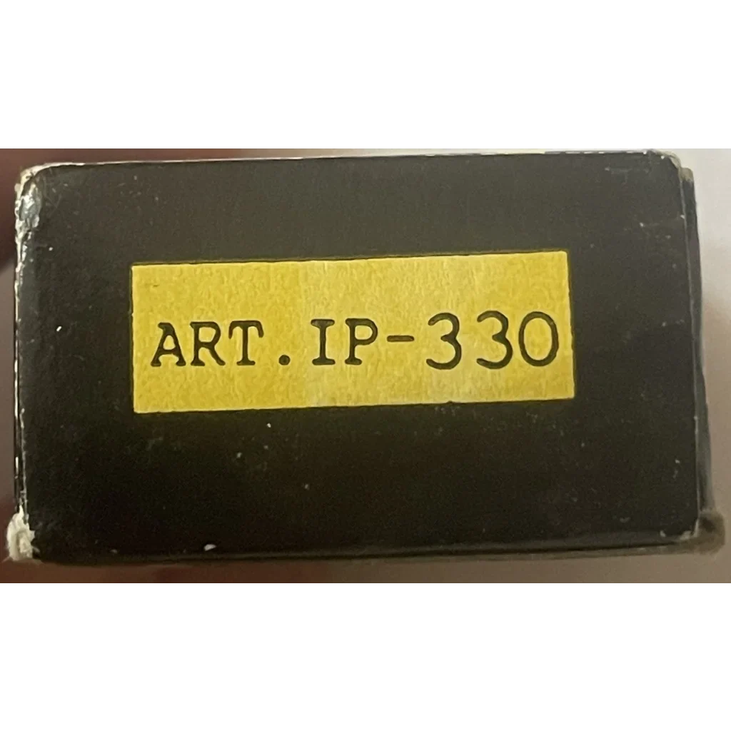 Black rectangular object with yellow label ART.IP-330 for Vintage 1950s GoldKey Iron Padlock