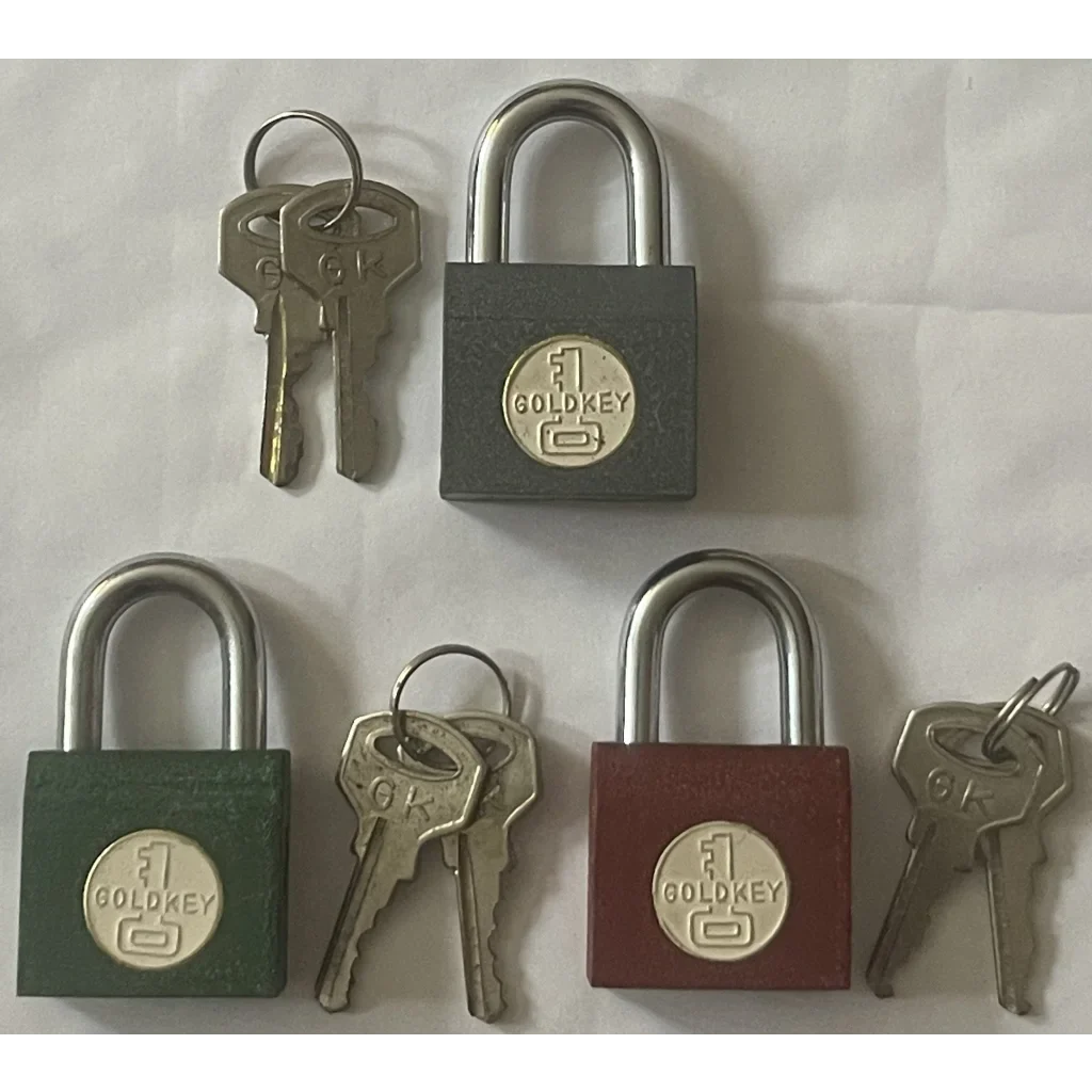 Three Godrej padlocks with keys, showcasing the Vintage 1950s GoldKey Iron Padlock design