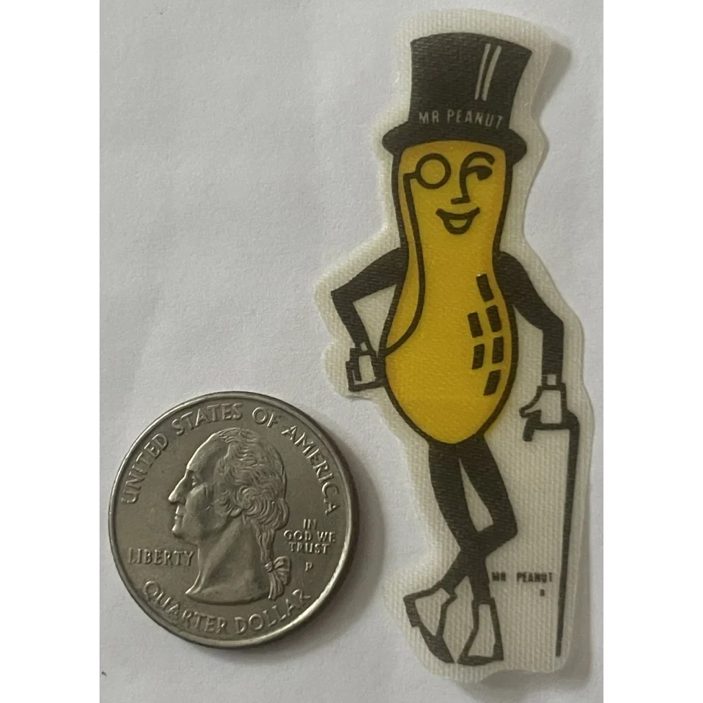 Smiling peanut cloth sticker mascot in a top hat holding a cane for vintage vibes